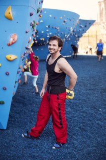 Caucasian man posing at outdoor climbing wall