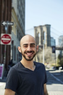 Smiling Hispanic man in city