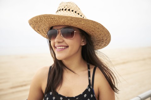 Mixed Race woman smiling on beach