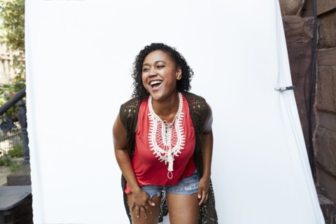 Mixed Race woman laughing