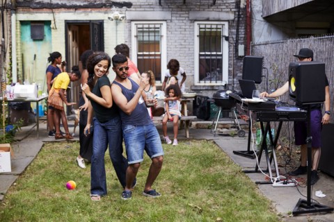 Couple dancing at backyard party