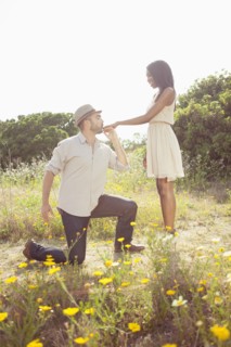 Man kissing girlfriend's hand