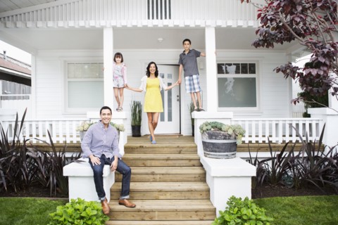 Family smiling together on porch