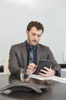 Caucasian businessman using digital tablet in office