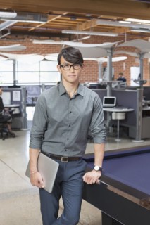 Businessman standing in office lounge area