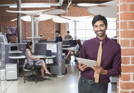 Businessman holding digital tablet in office