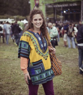 Woman wearing decorative poncho at festival
