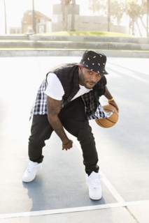 African American man playing on basketball court