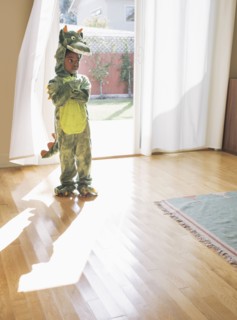 African American girl wearing dragon costume