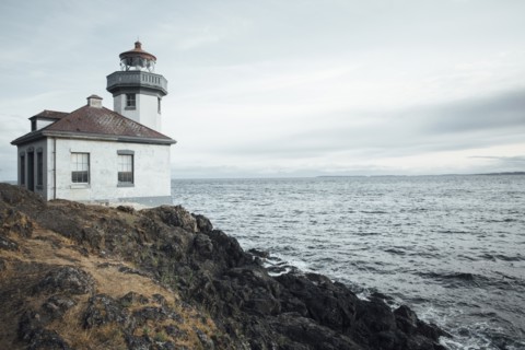 Lighthouse on rocky beach