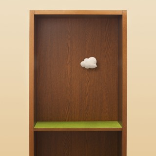 Cloud floating in empty bookshelf