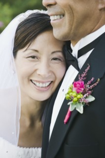 Asian newlyweds hugging