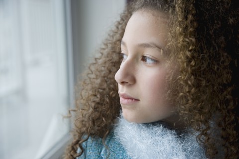 Mixed race girl in scarf and jacket