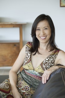 Japanese woman sitting on sofa