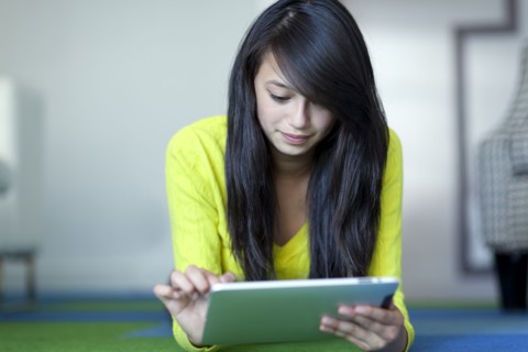 Asian girl using digital tablet