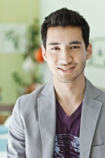 Smiling mixed race man in jacket