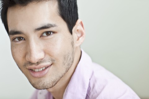 Smiling mixed race man