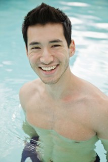 Mixed race man in swimming pool
