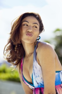 Hispanic woman puckering lips