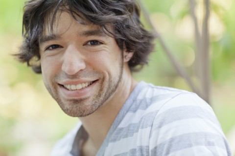 Smiling mixed race man