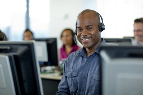 Business people working on computers in call center
