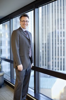 Smiling Caucasian businessman standing in office