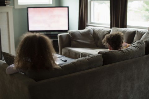 Mother and daughter watching television