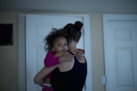 Mother holding daughter