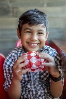 Smiling boy holding burger