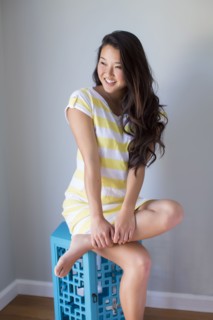 Japanese woman smiling on stool