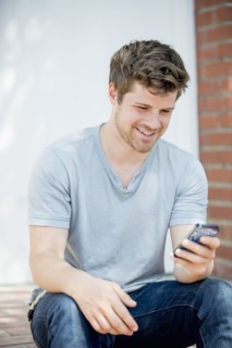 Man using cell phone outdoors