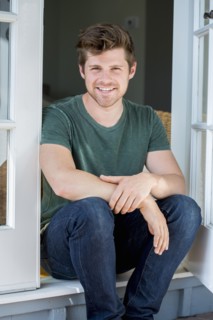 Man sitting in doorway