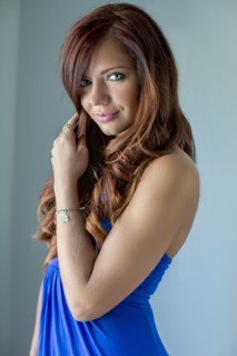 Smiling woman in blue dress