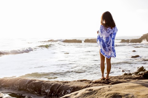 Japanese woman standing on beach
