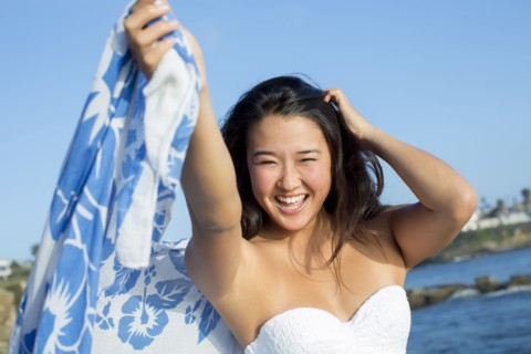 Japanese woman smiling on beach