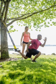 Caucasian man working with trainer outdoors