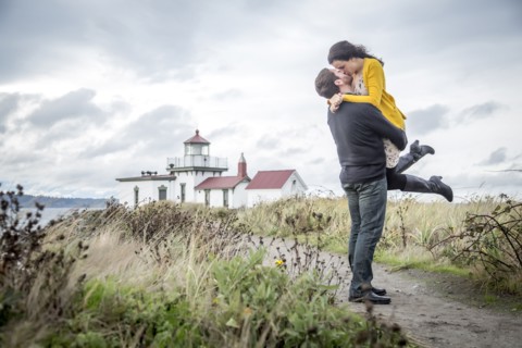 Caucasian couple hugging on beach path