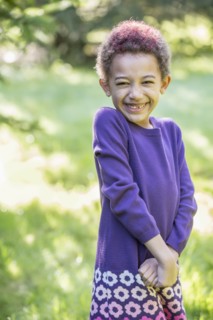 Mixed race girl smiling outdoors