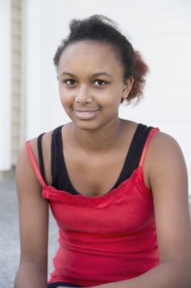 Mixed race girl smiling outdoors