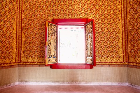 Ornate wall and window in Wat Chayamangkalaram temple