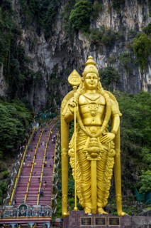 Gold statue of Murugan outside Batu Caves