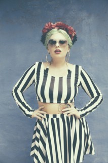Caucasian woman wearing striped outfit