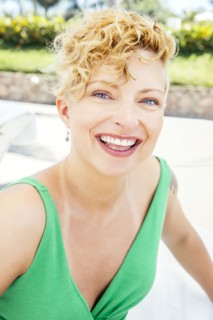 Caucasian woman smiling on beach