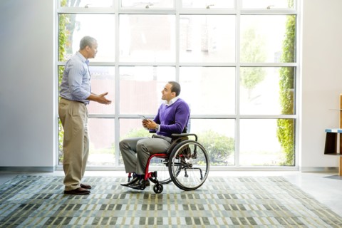 Businessmen talking in office