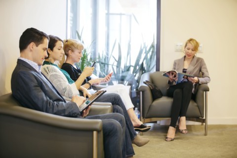 Business people waiting in office lobby