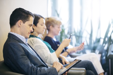 Business people waiting in office lobby