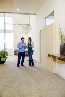 Business people talking in office hallway