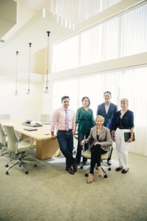 Business people smiling in office meeting