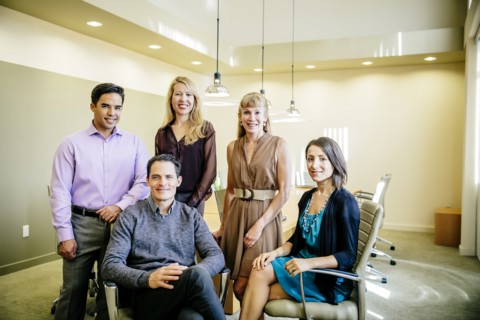 Business people smiling in office meeting