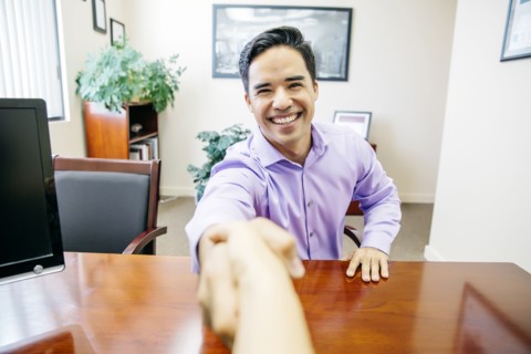 Business people shaking hands in office